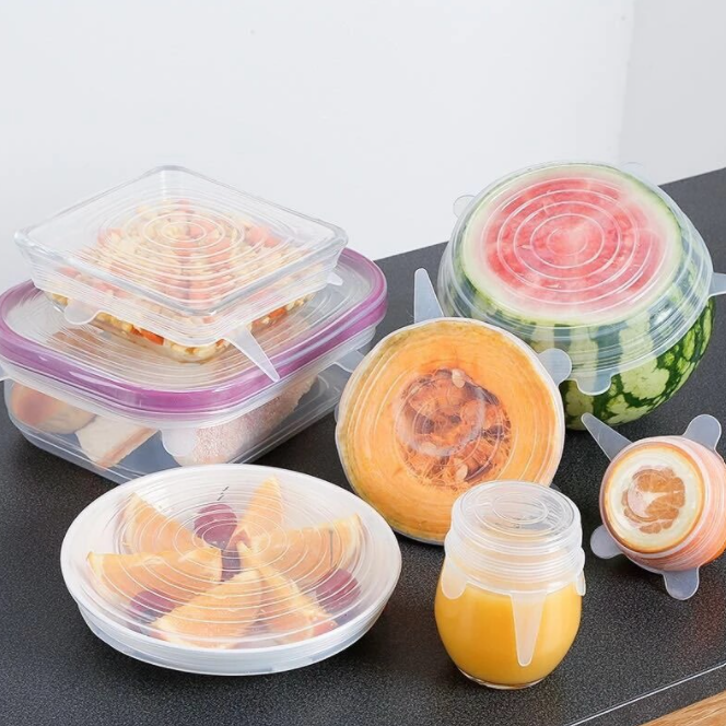 Watermelon, melon, orange, juice, cherries and sweets in food silicon covers