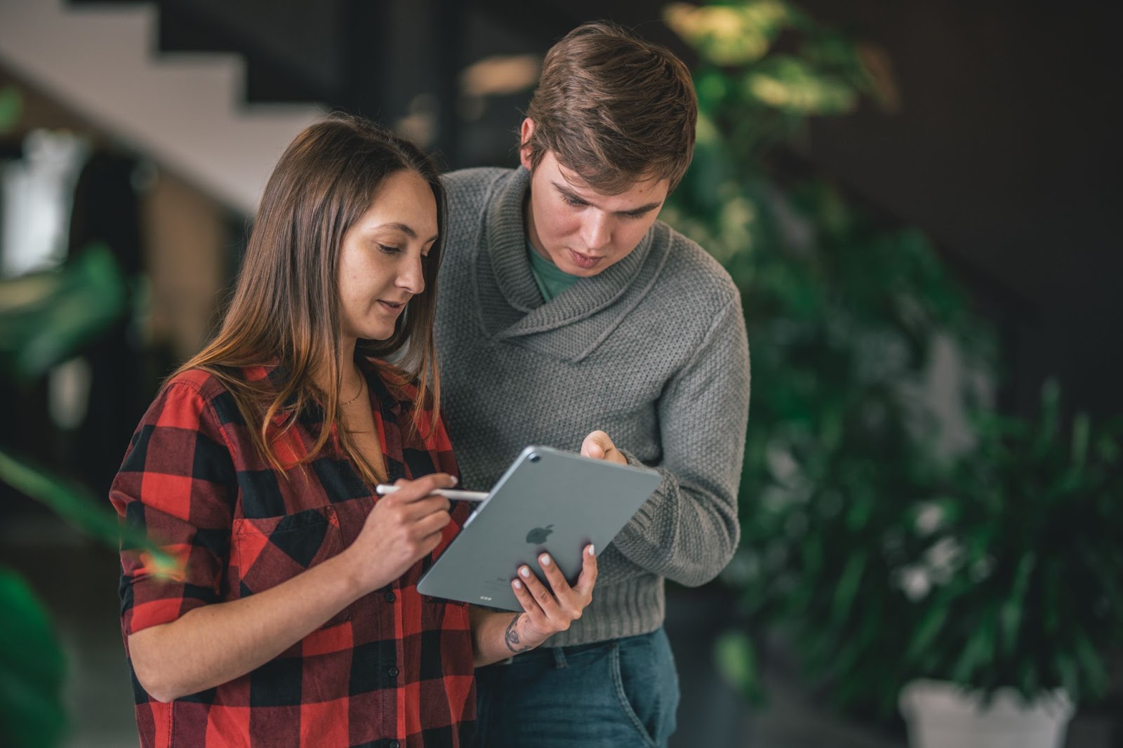 male and female colleagues discussing wage transparency