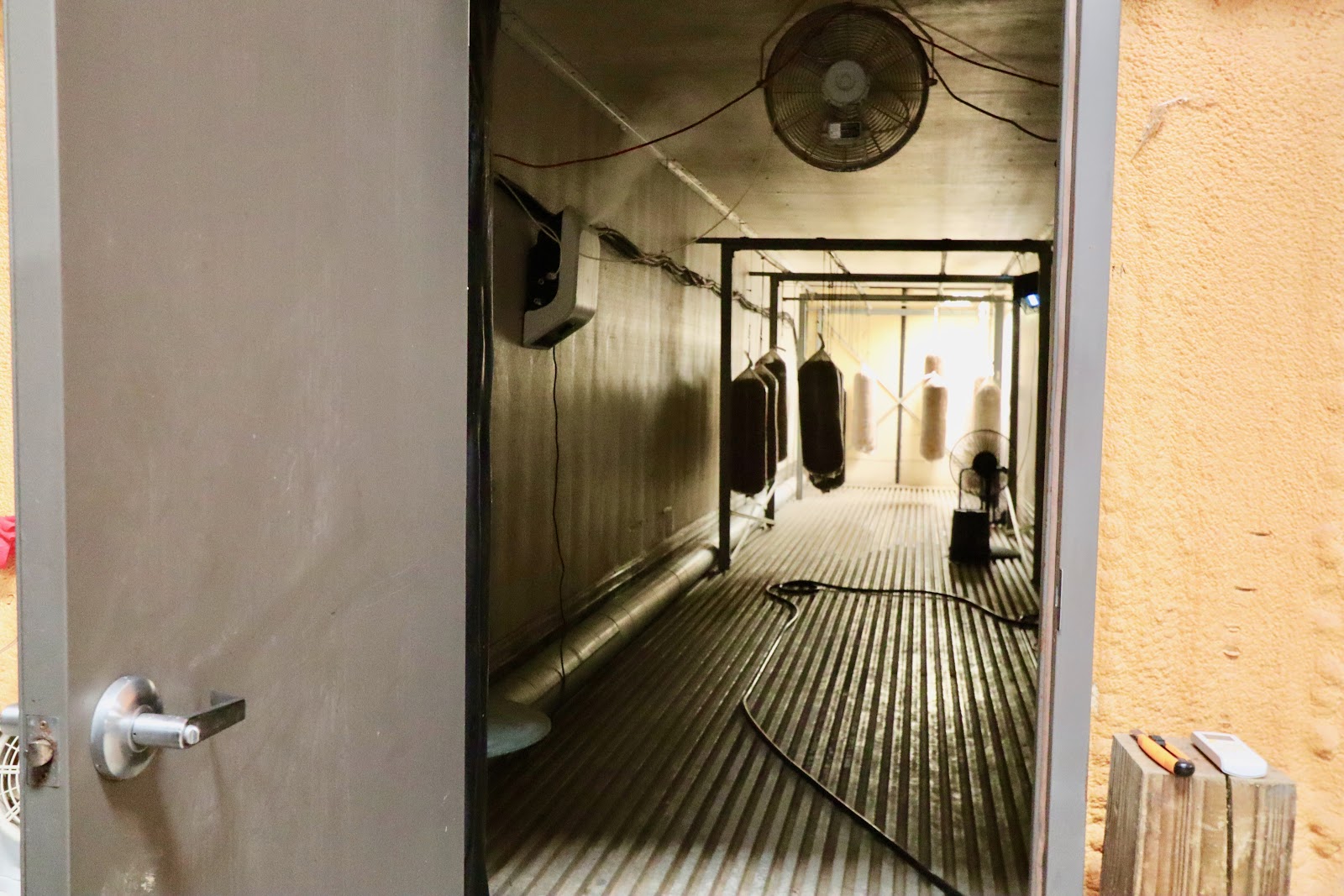 Right behind these unassuming doors are climate controlled trailers Raburn bought second hand as an experimental method to grow mushrooms. To no one's surprise, his methods worked fabulously. (Photo by Christine Hull for Bham Now)﻿