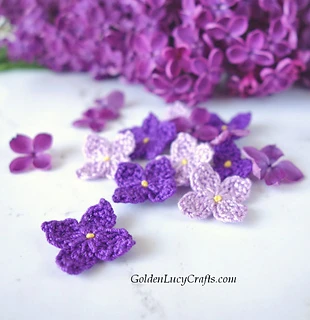 beautiful crochet thread flowers in shades of purple