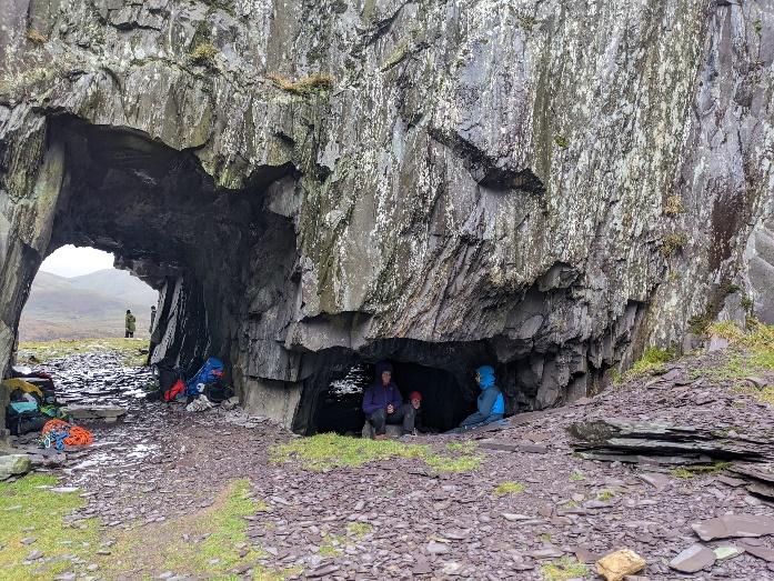 A group of people in a cave

Description automatically generated with medium confidence