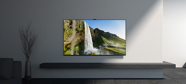 Wall-mounted BRAVIA TV with waterfall screenshot above plinth