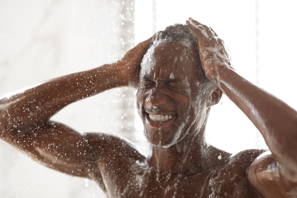 black man shampooing and conditioning his hair