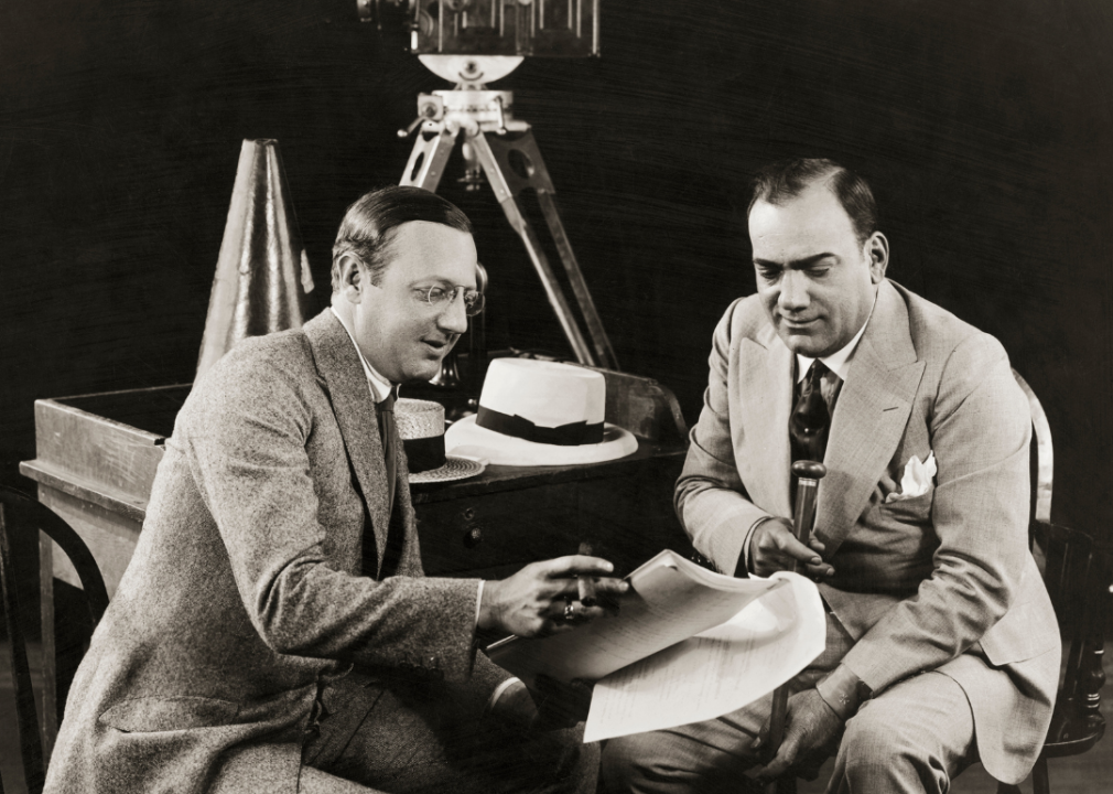 Enrico Caruso discusses script with Jesse L Lasky.
