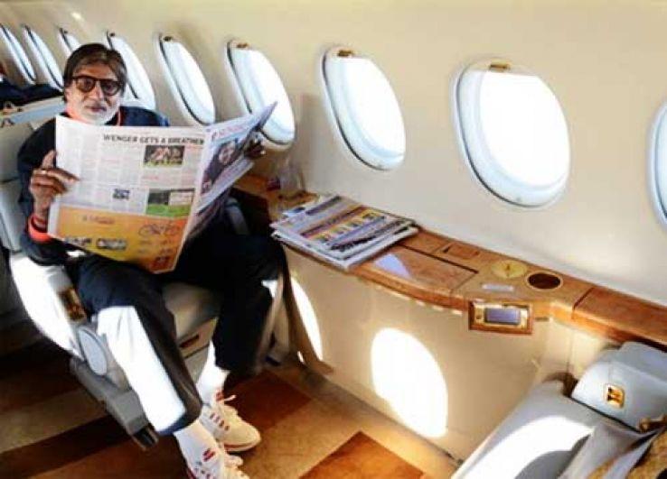 A person reading a newspaper in a plane

Description automatically generated