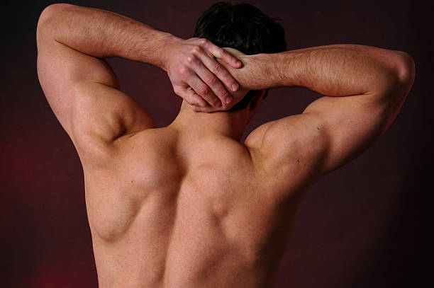 A portrait of a man's back side after back hair removal