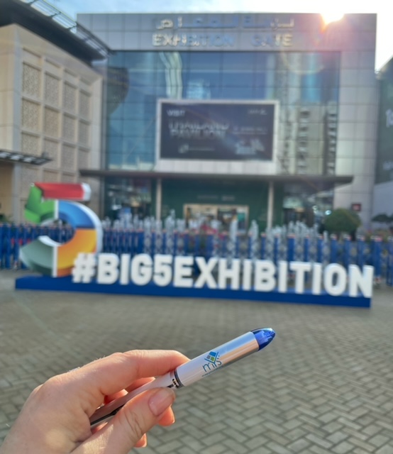 Abby Ingraham holding an MYS pen at the 2022 Big 5 Exhibition in Dubai.