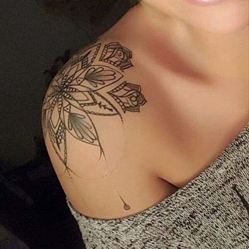 lady wearing plant tattoo on her shoulder top