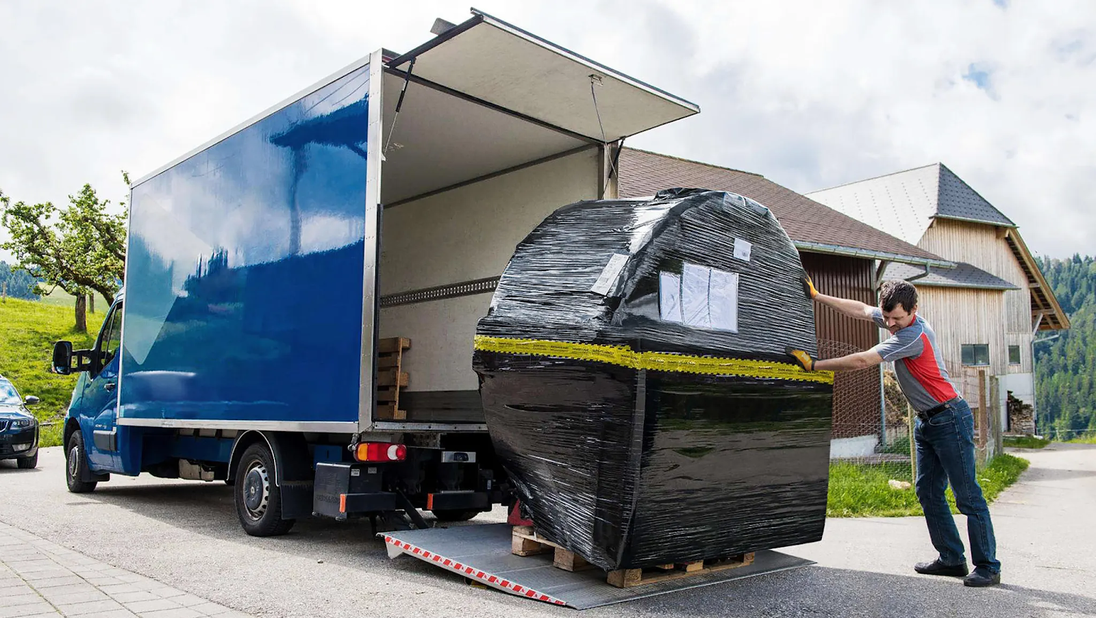 Skargards hot tub delivery - unloading from the vehicle with a tail lift.