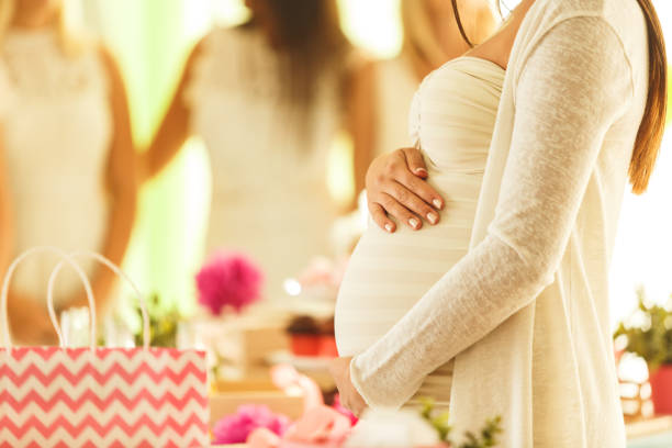 what to wear to a baby shower as the mother-to-be