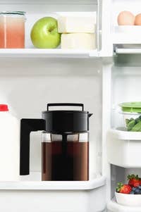 The cold brew iced coffee maker inside a fridge.