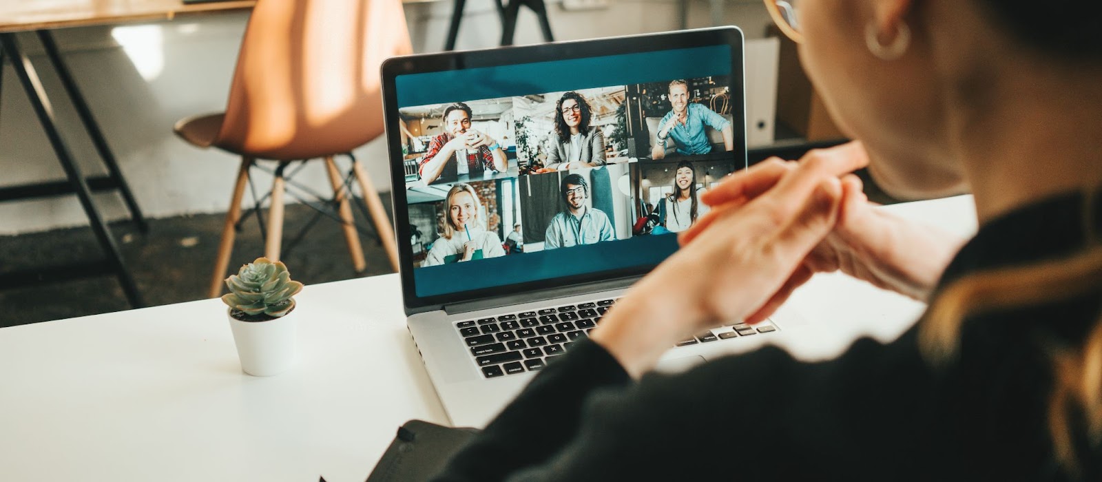 Person attends a team meeting over video conference