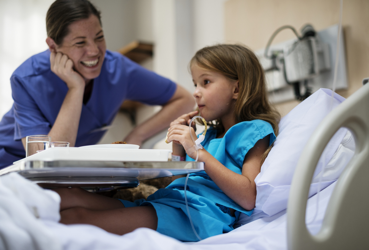 A person and a child in a hospital bed

Description automatically generated