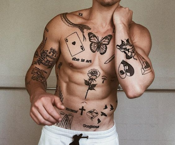 Full picture of a guy showing off his cool chest patchwork tattoo