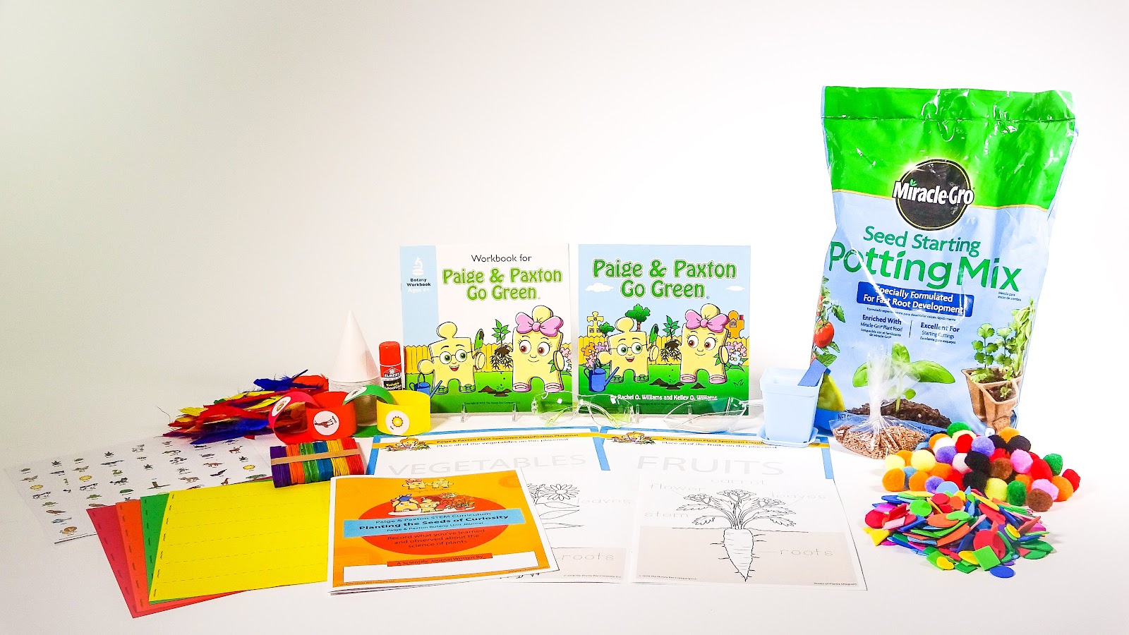 This shows all of the items included in this Botany-focused STEM kit for elementary students, including fertilized potting soil, STEM stories, diorama materials and labeled diagrams of plant parts.