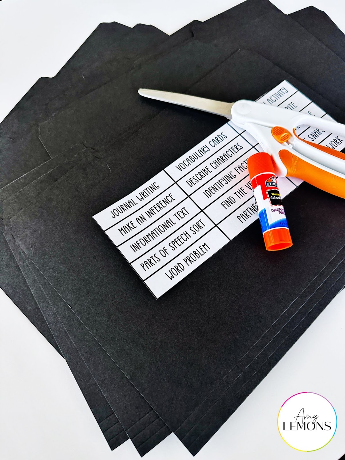 Black internal folders with white labels to hold activities for substitute plans. 