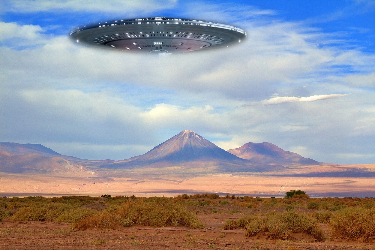 An image showing a flying saucer over mountains