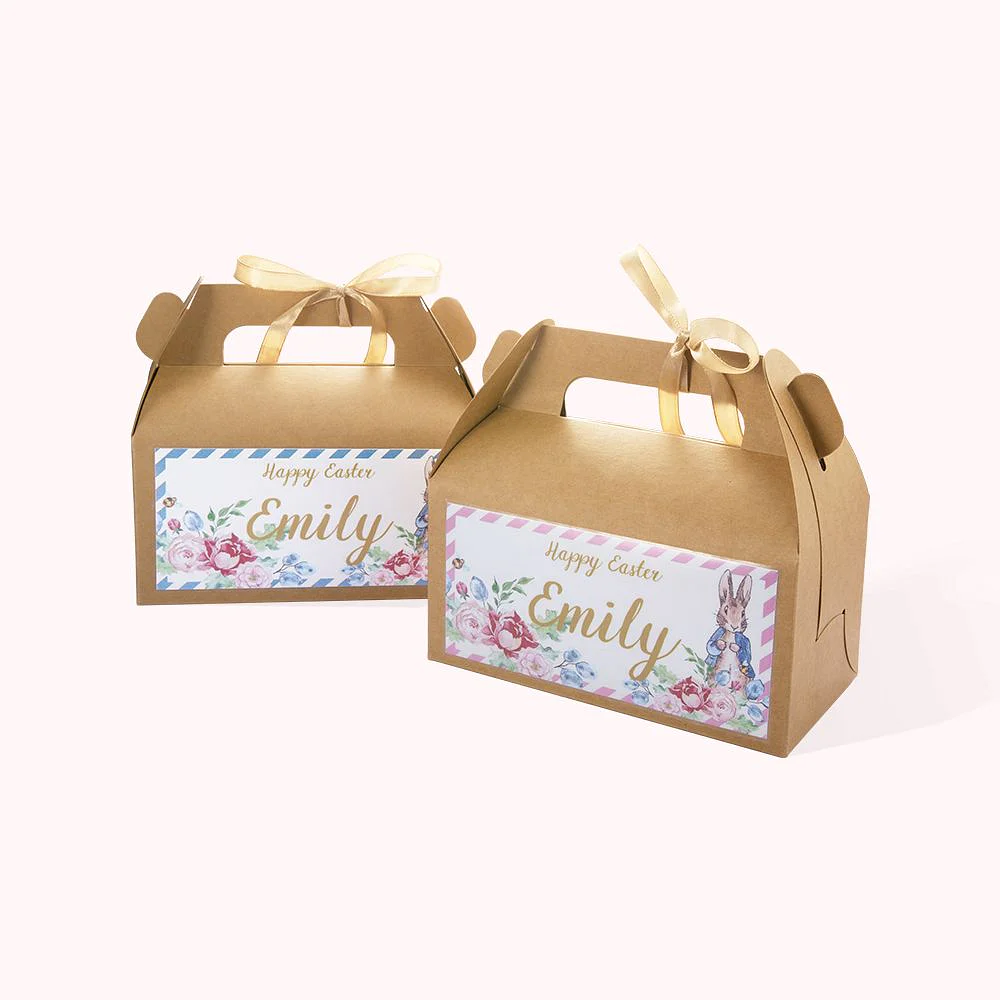 2 boîtes de bonbons en carton Kraft personnalisées par un prénom et un message de Joyeuses Pâques.