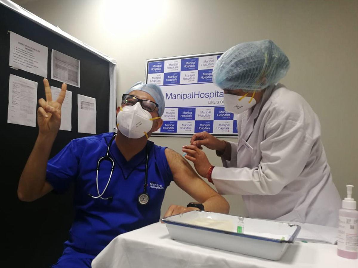 Doctor being administered COVID-19 vaccine