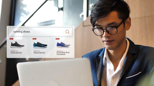 Man looking at search results for running shoes