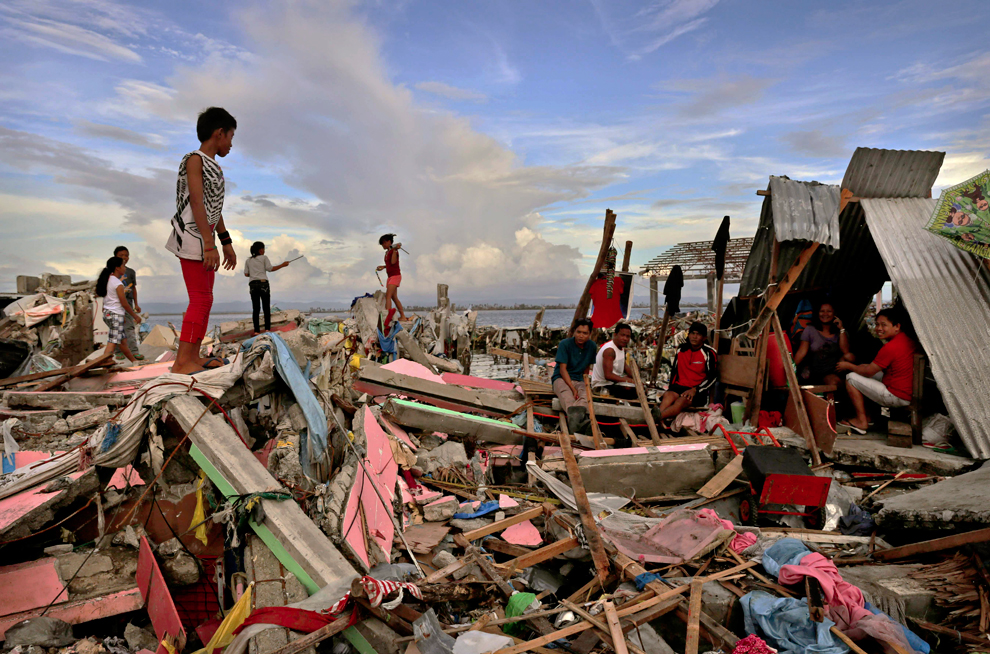 Boy standing on pile of rubbles.

Source: http://archive.boston.com/bigpicture/2013/11/aftermath_of_typhoon_haiyan.html
