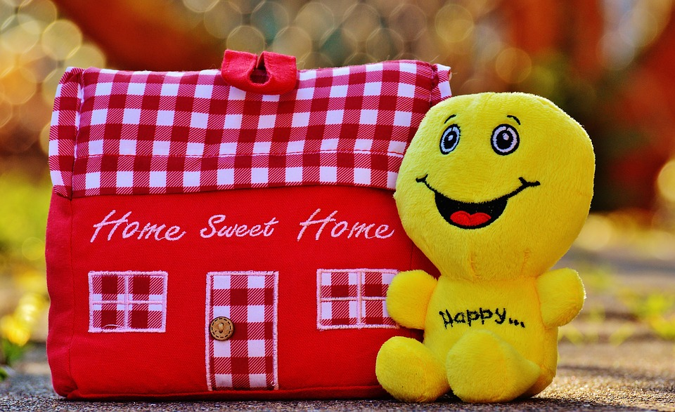 Closeup of happy toys on wooden background