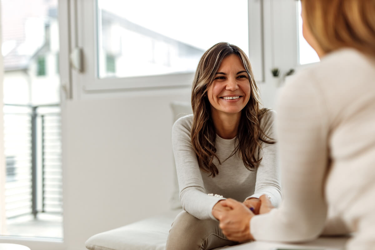 Clinical decision support: patient happily talking to a doctor