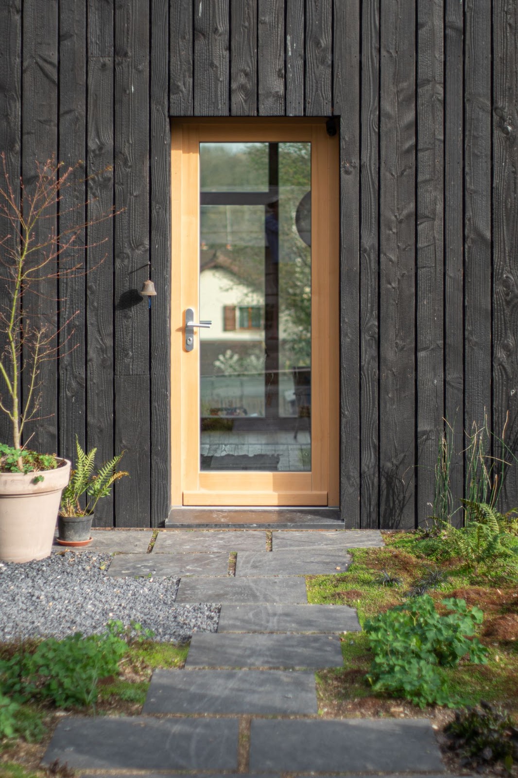 a glass door with a wooden door frame - 
barndominium front door ideas