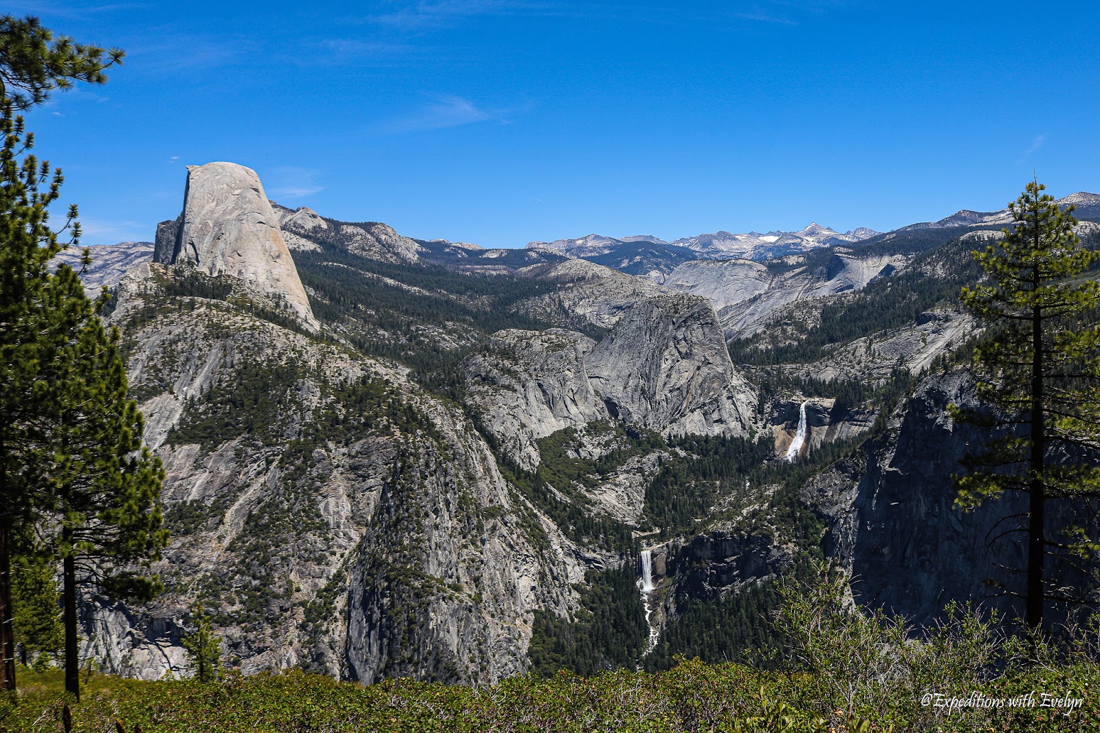 A panoramic view of Yosemite icons - Half Dome, Vernal Fall and Nevada Fall.