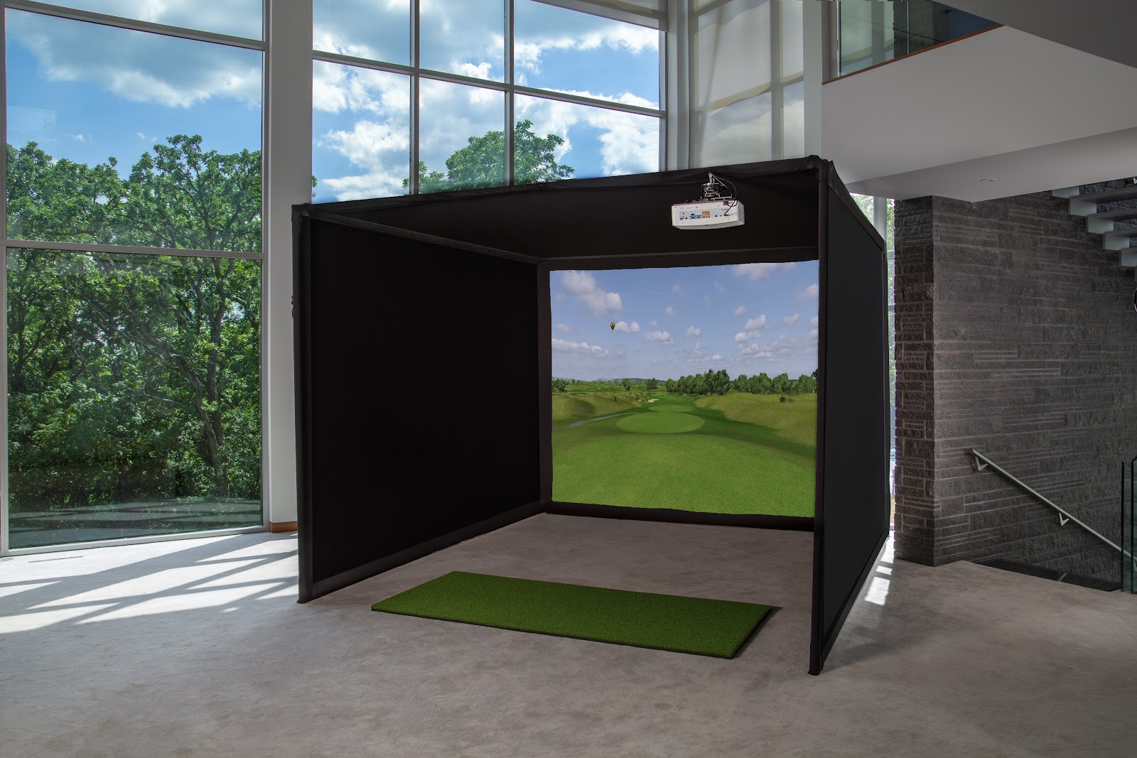 Golf hitting mat in a Carl's Place Enclosure