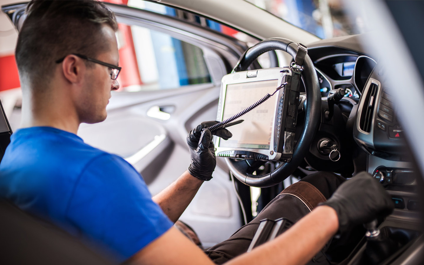 mechanic diagnosing car's system