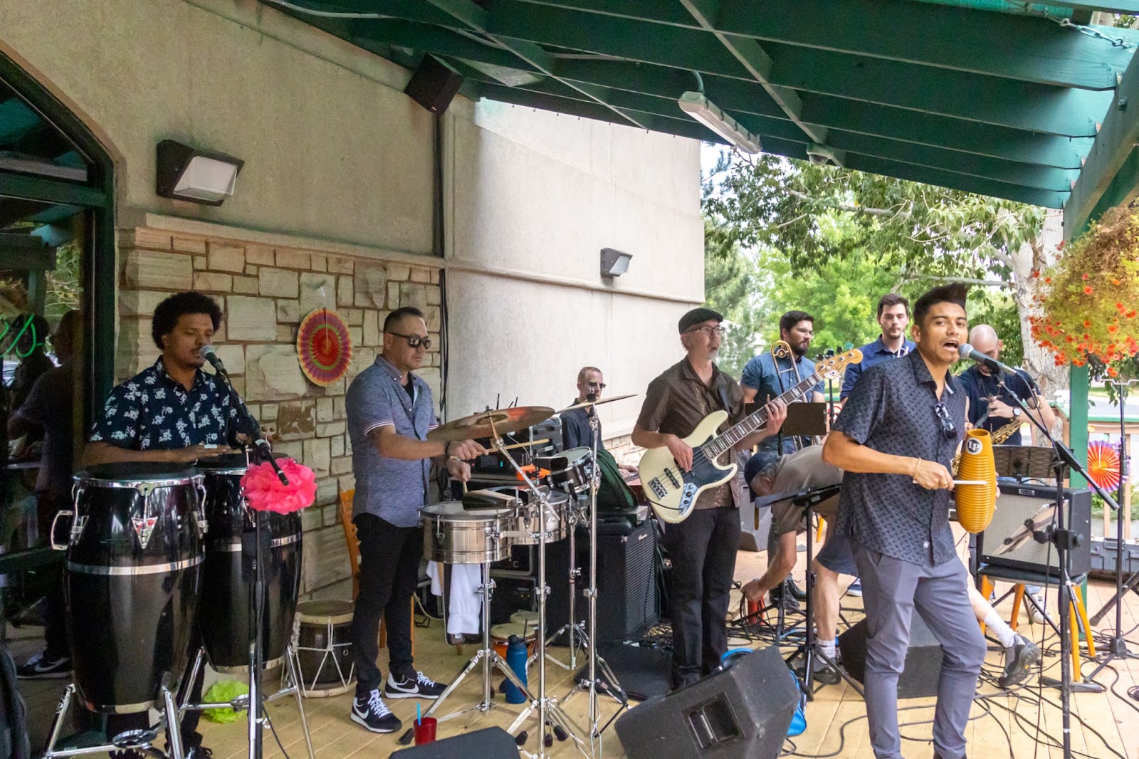 Local favorite Manabi Latin Band performs on the outdoor patio at the 2021 Family Center/La Familia Fiesta Party in Fort Collins, Colorado.