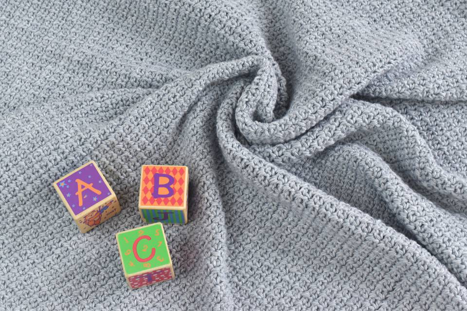 18 Free Crochet Baby Blanket Patterns. Need a gift for your next baby shower? Try one of these FREE baby blankie patterns to crochet for boys and girls. | TLYCBlog.com