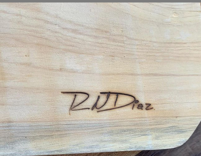 Signature on wood using a branding iron